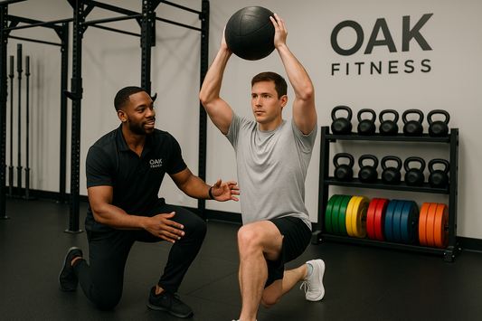 A diverse fitness trainer working with a male client performing functional fitness exercises in a modern gym setting